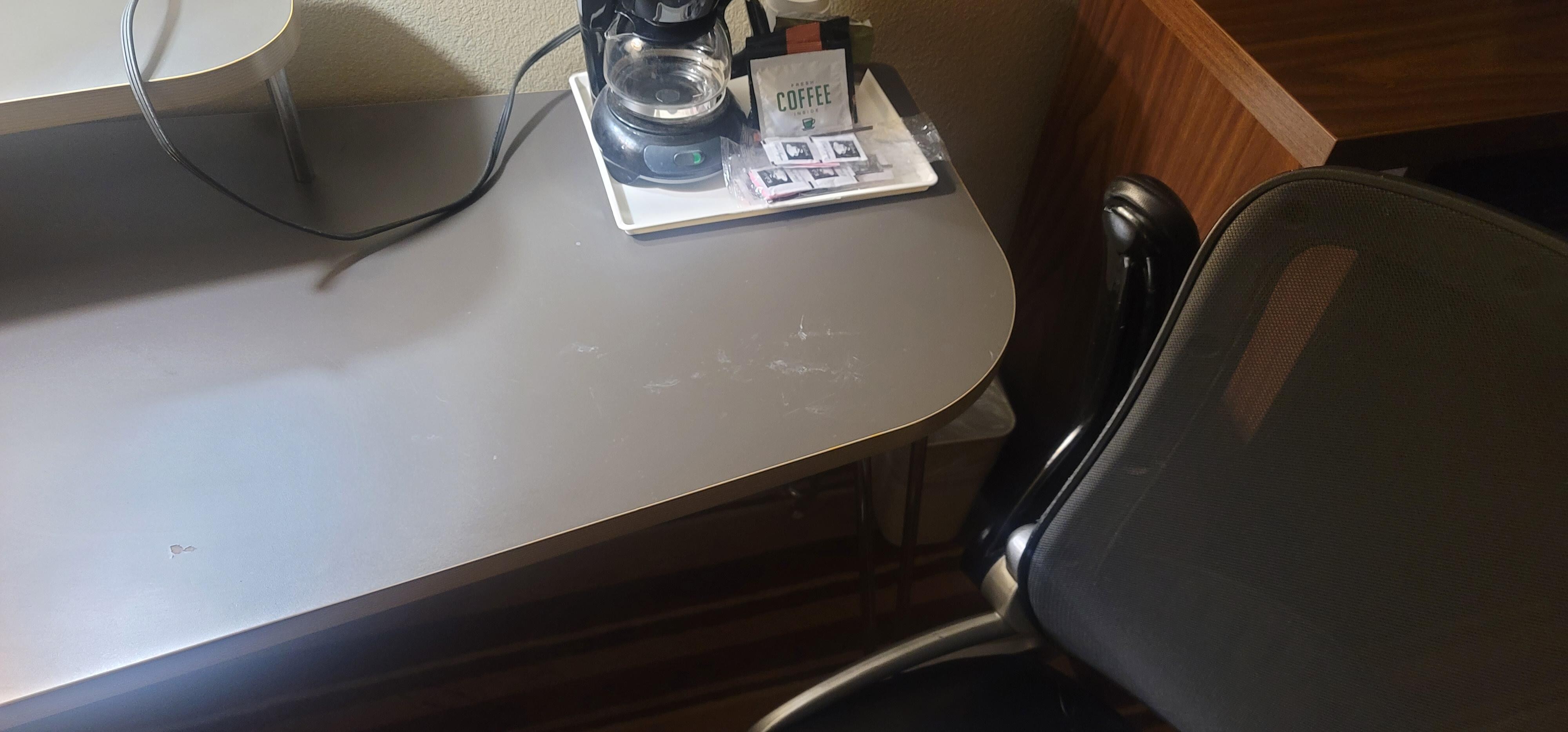 The filthy desk. Everything in the room was dirty. I had to ask for clean sheets and make up the beds myself. There was food under both beds. Disgusting. 