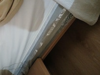 Plastic covered mattress under sheets