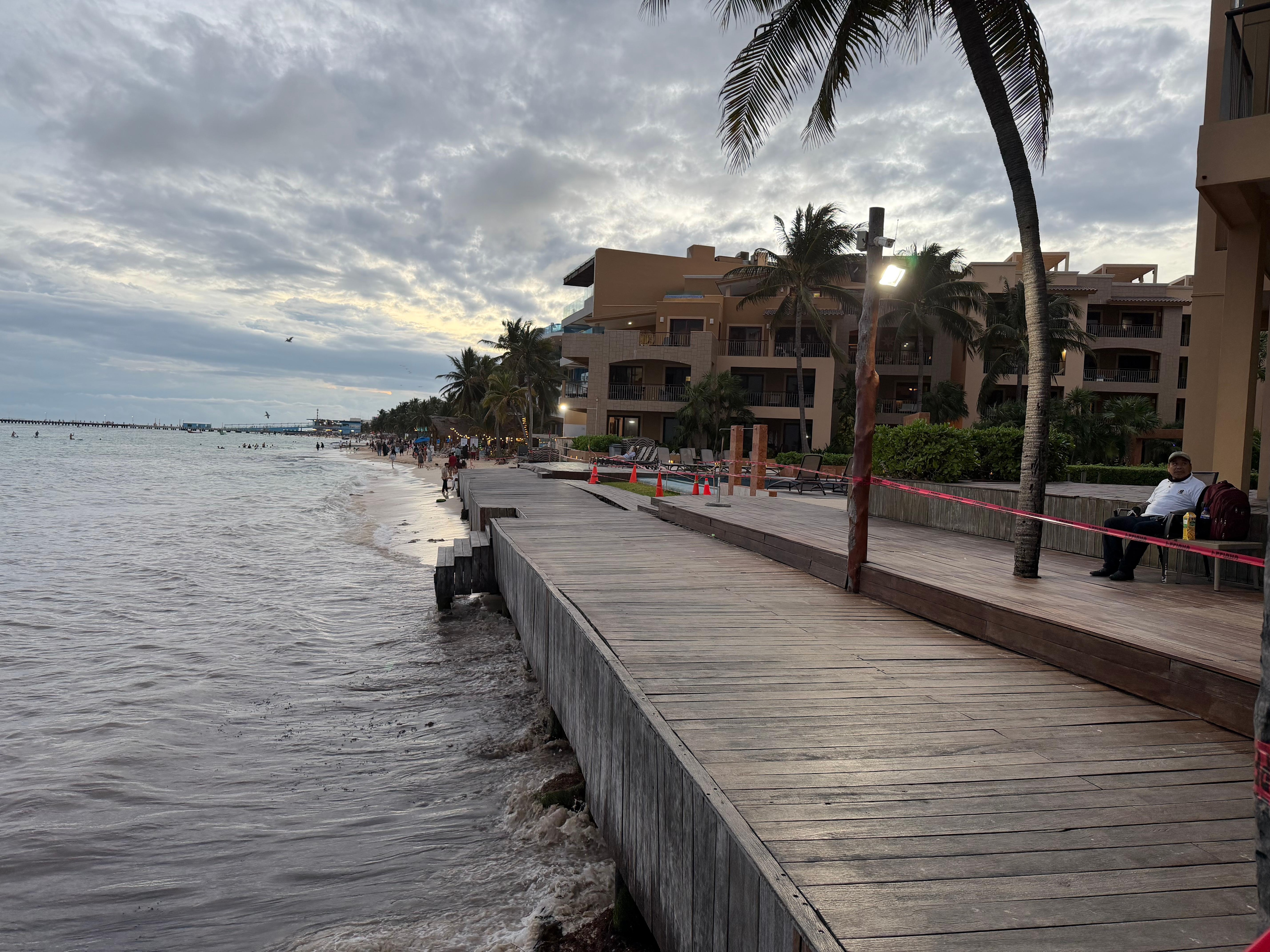 View looking south in front of property. No beach where listing photos have a beach with loungers.
