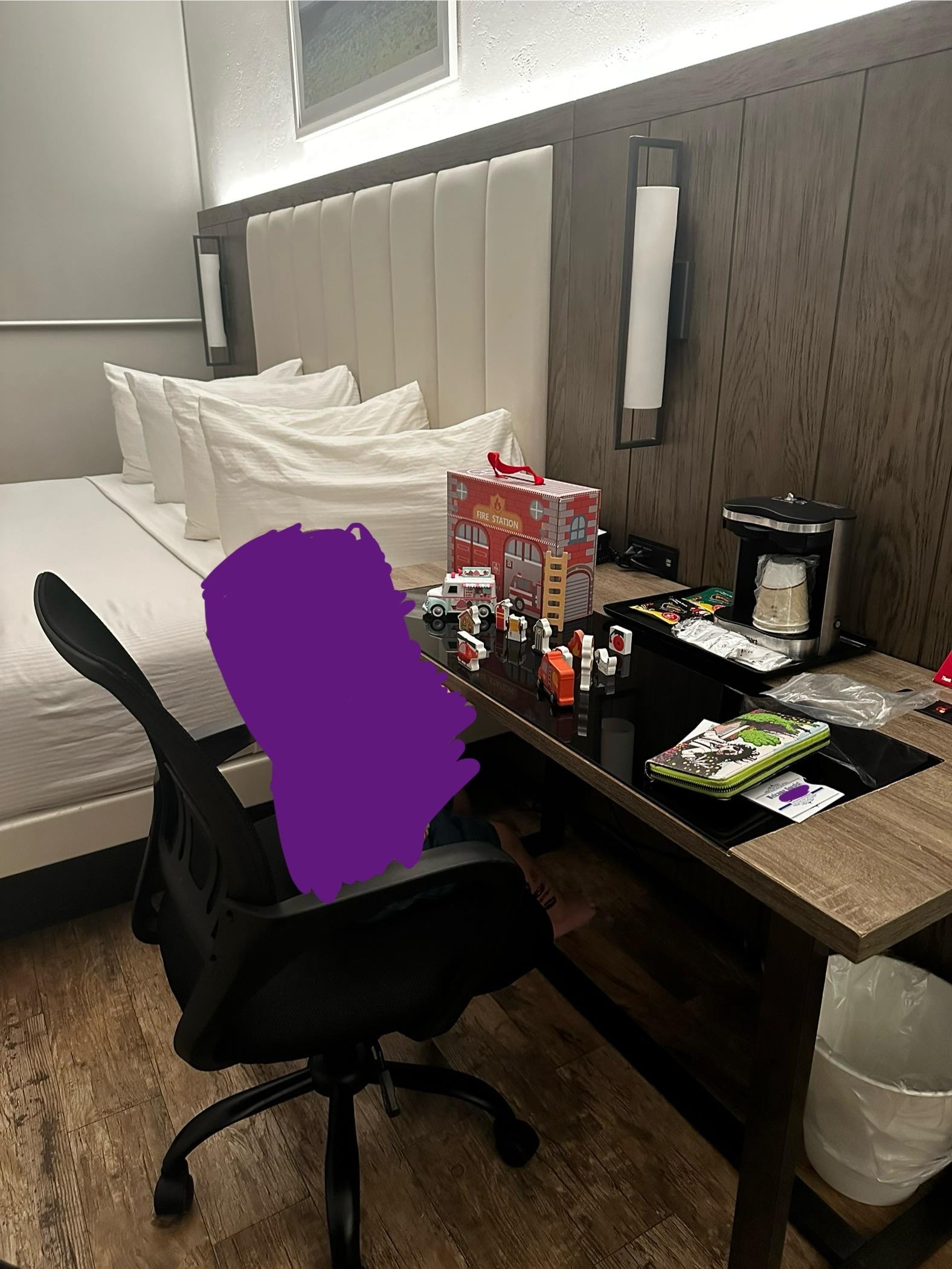 Spacious desk with coffee maker. Microwave and small refrigerator in closet too. 