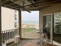 View of the beach/ocean from the bedroom! Loved falling asleep and waking up to the sound of waves!