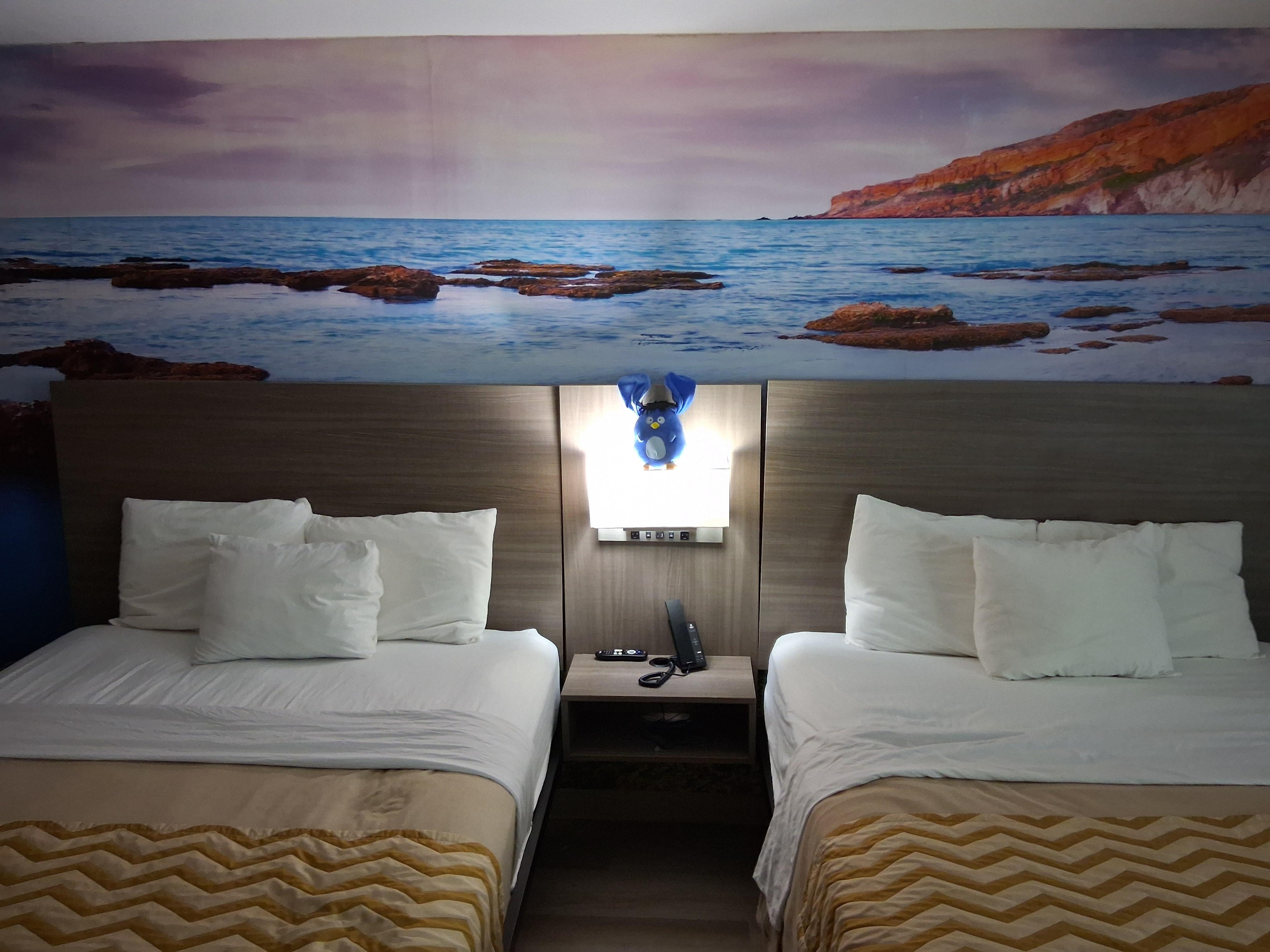 Postcards from Puu (the plushie.) He was not touching any bulbs. Just wanted to capture the beauty of the wall.