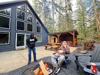 Back deck with fire pit, sauna and hot tub.
