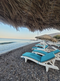 Beach chairs with amazing food and staff I believe it's called Elle