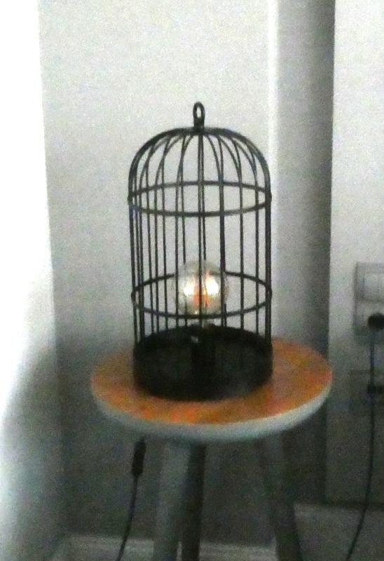 What a wonderful, artistic lamp! Unfortunately, it takes up nearly all of the table space next to the bed, so there’s no room for anything that *you* want to put there.