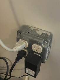 An actual metal electrical receptacle suited for outdoor protruding inside