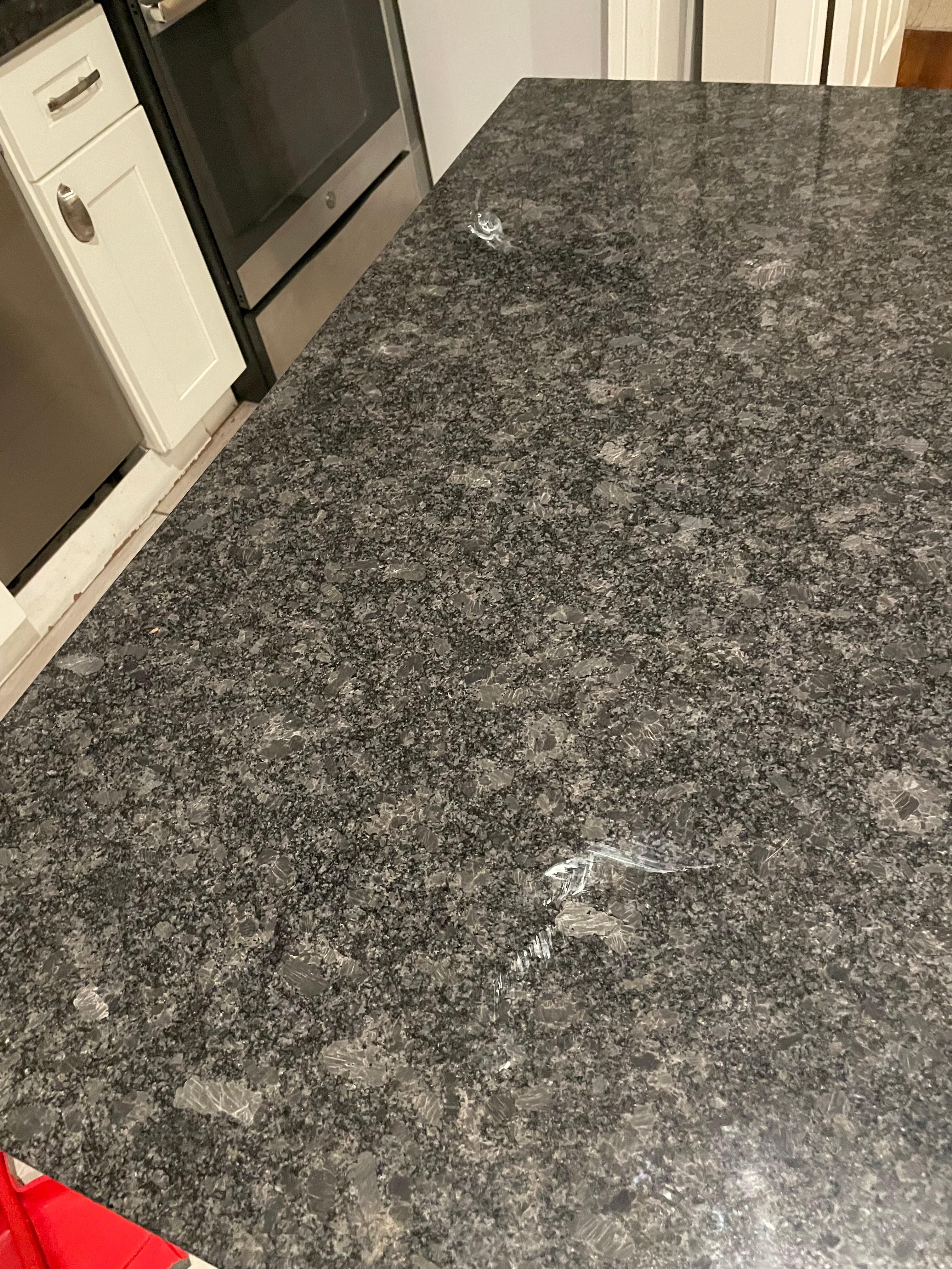 Paint and dead flies and grime and dirt on counters