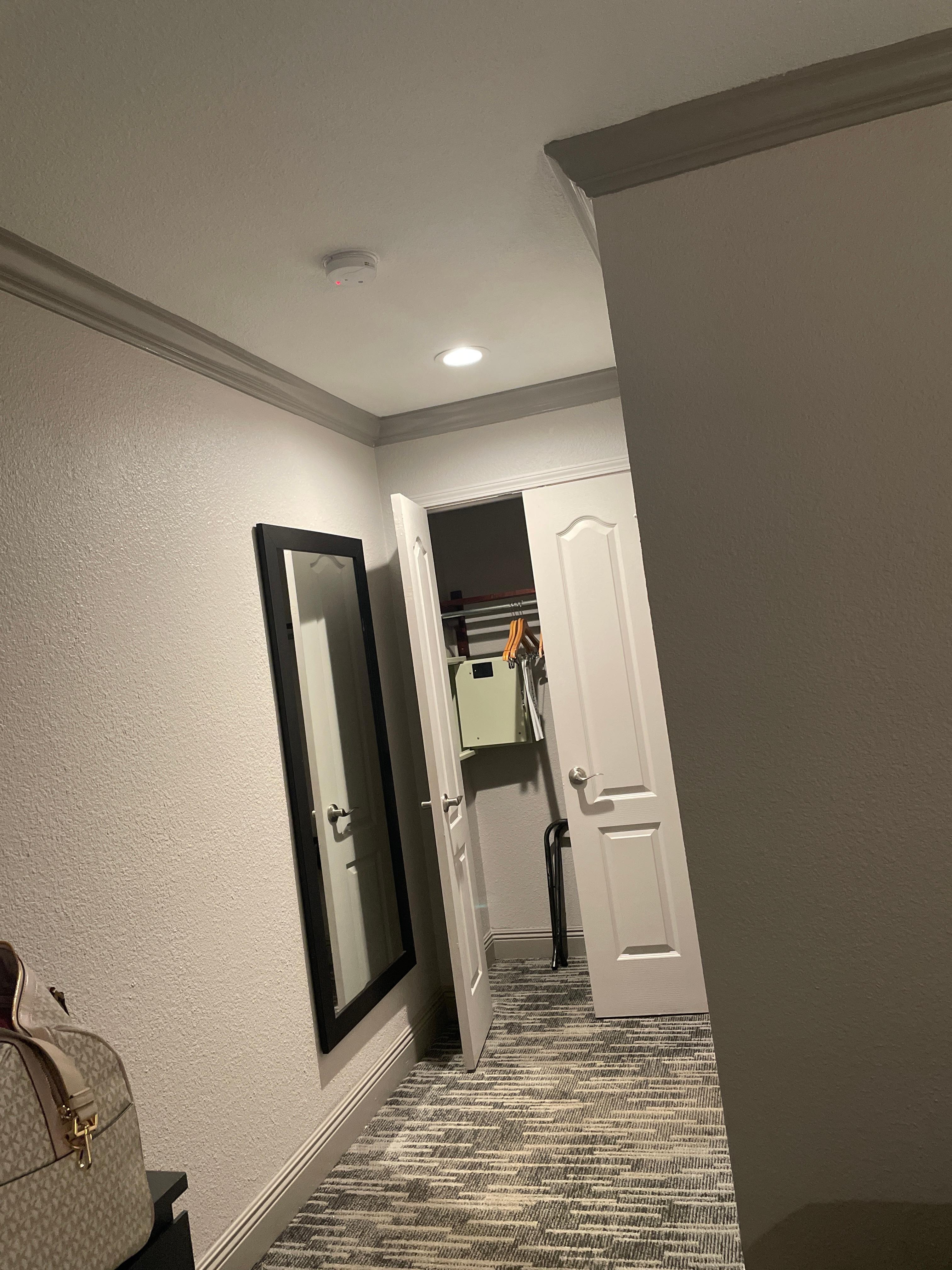 Closet area and the bathroom is to the right, both very clean. 