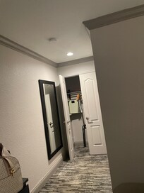 Closet area and the bathroom is to the right, both very clean.