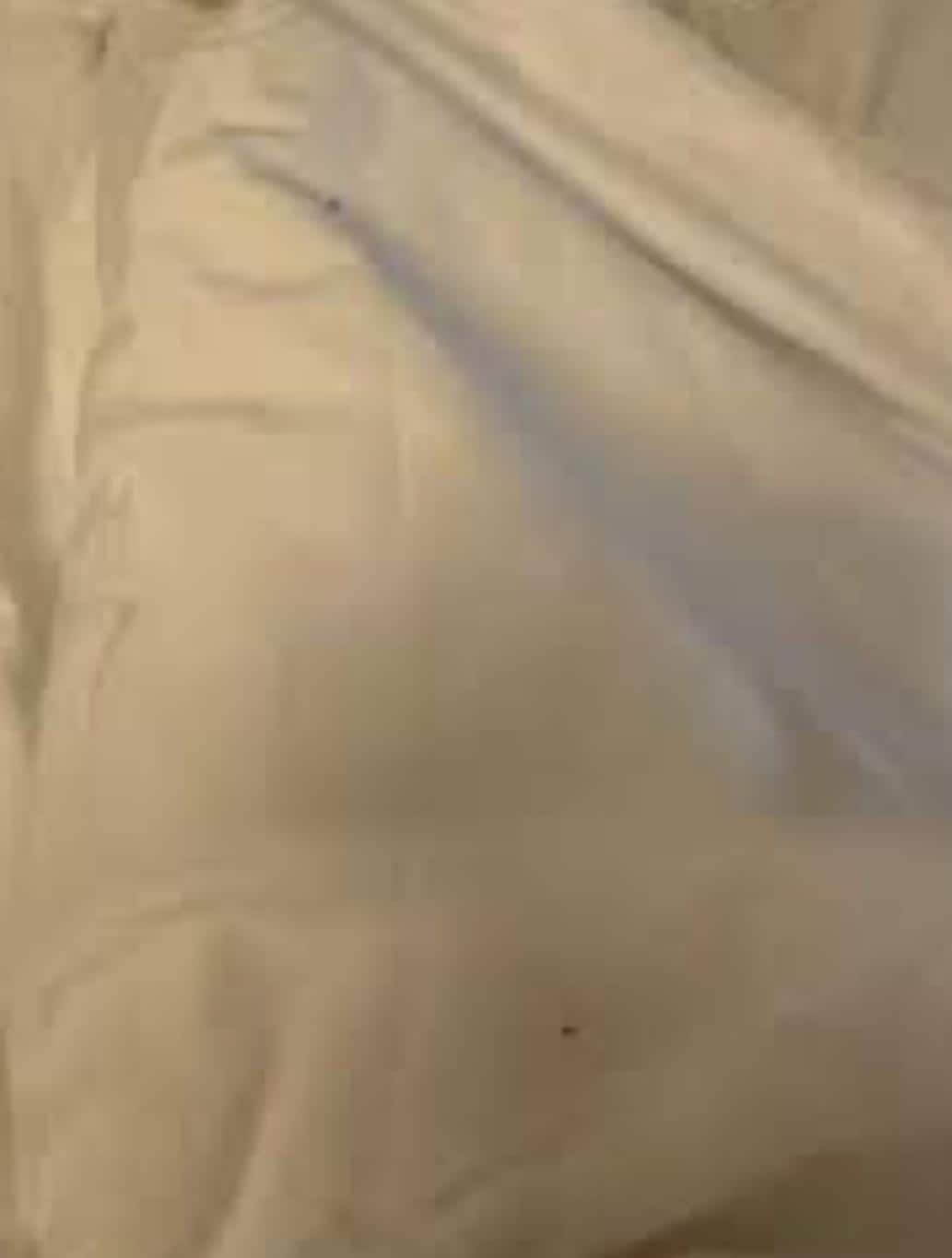 Bed at night with blood stains