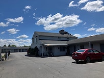 Well maintained building, pool area and landscaping.