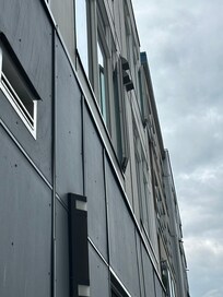 The window is blocked so it cannot open more than an inch or so. We are looking up at it here (open to max) from the parking lot below.