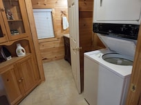 Laundry room leading to downstairs bathroom