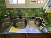 uncleaned sink with old dishes
