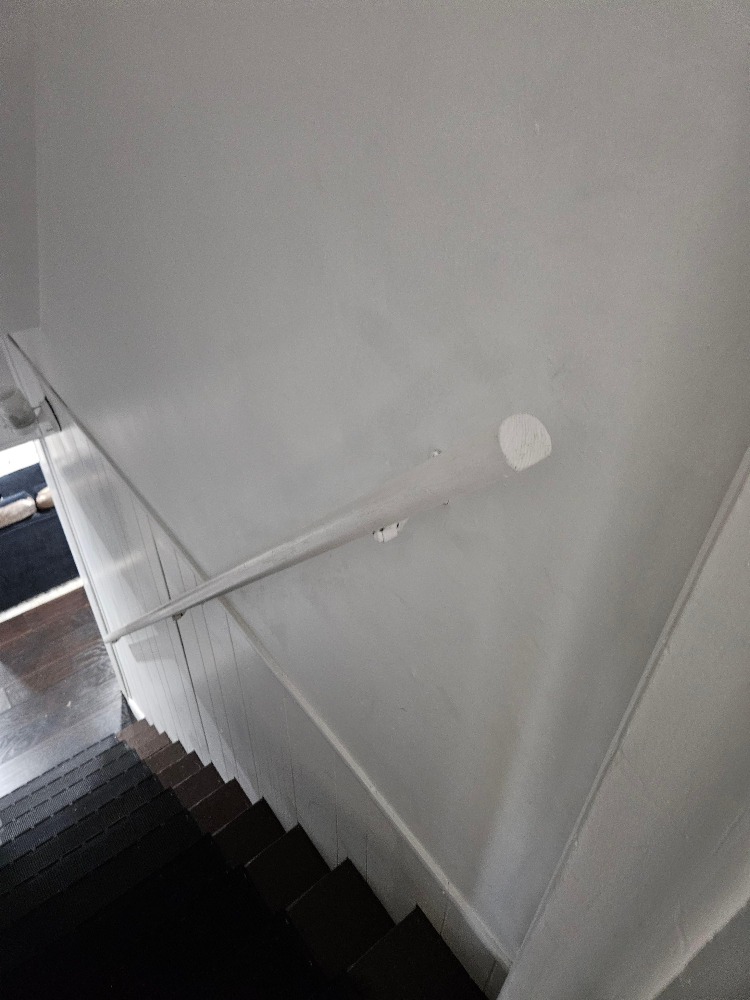 Banister is installed upside-down and is not attached firmly to wall. 