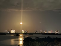 Full moon rising from the balcony.