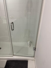 Moldy shower and no shelf the body wash and shampoo are on the floor