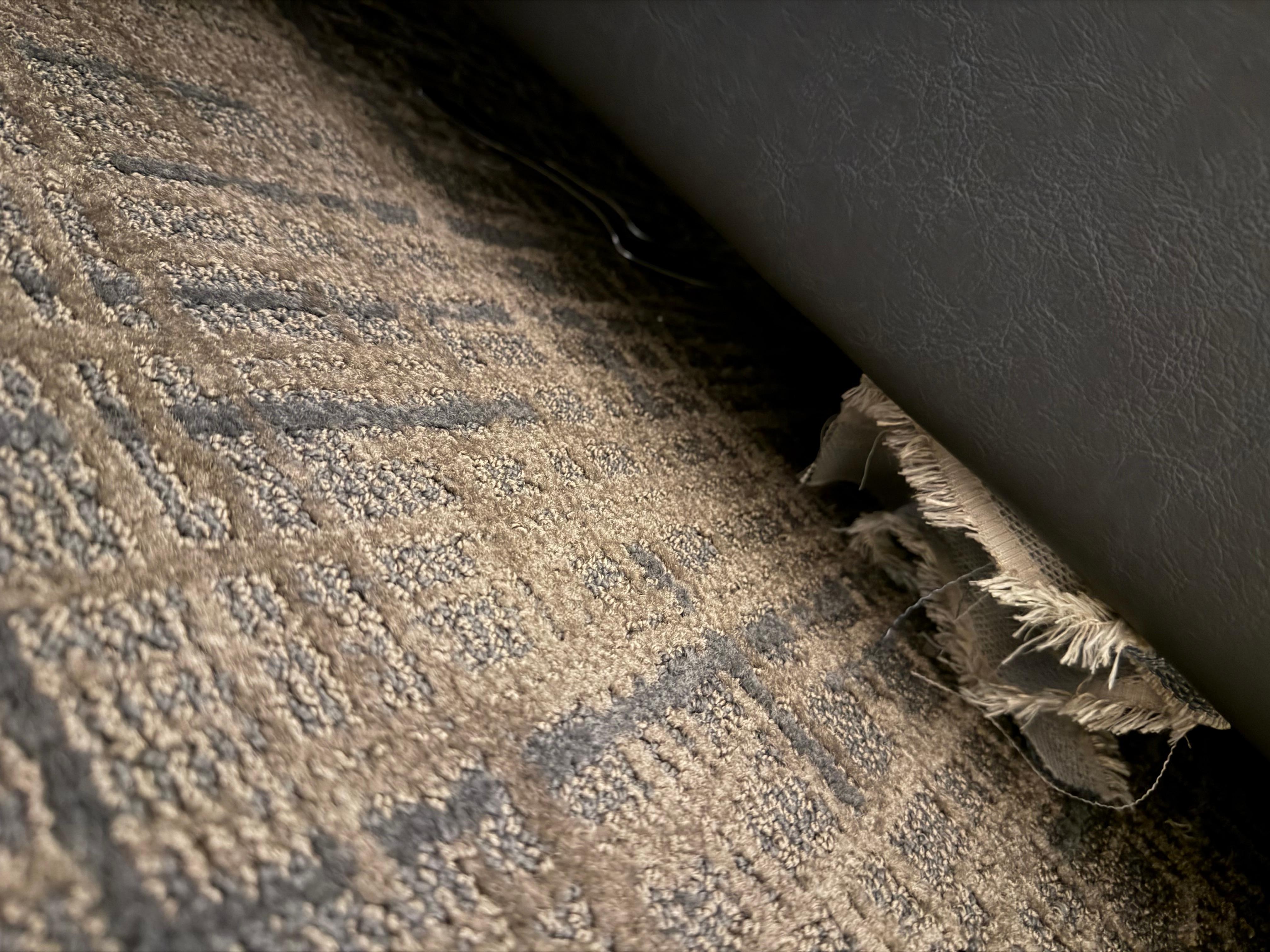 The room was dirty with old fork and spoon under the sofa that was never cleaned. 