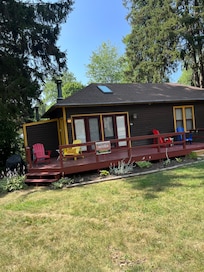 Front of house with about 4 angled parking spots right in front of it. No side or back yard.