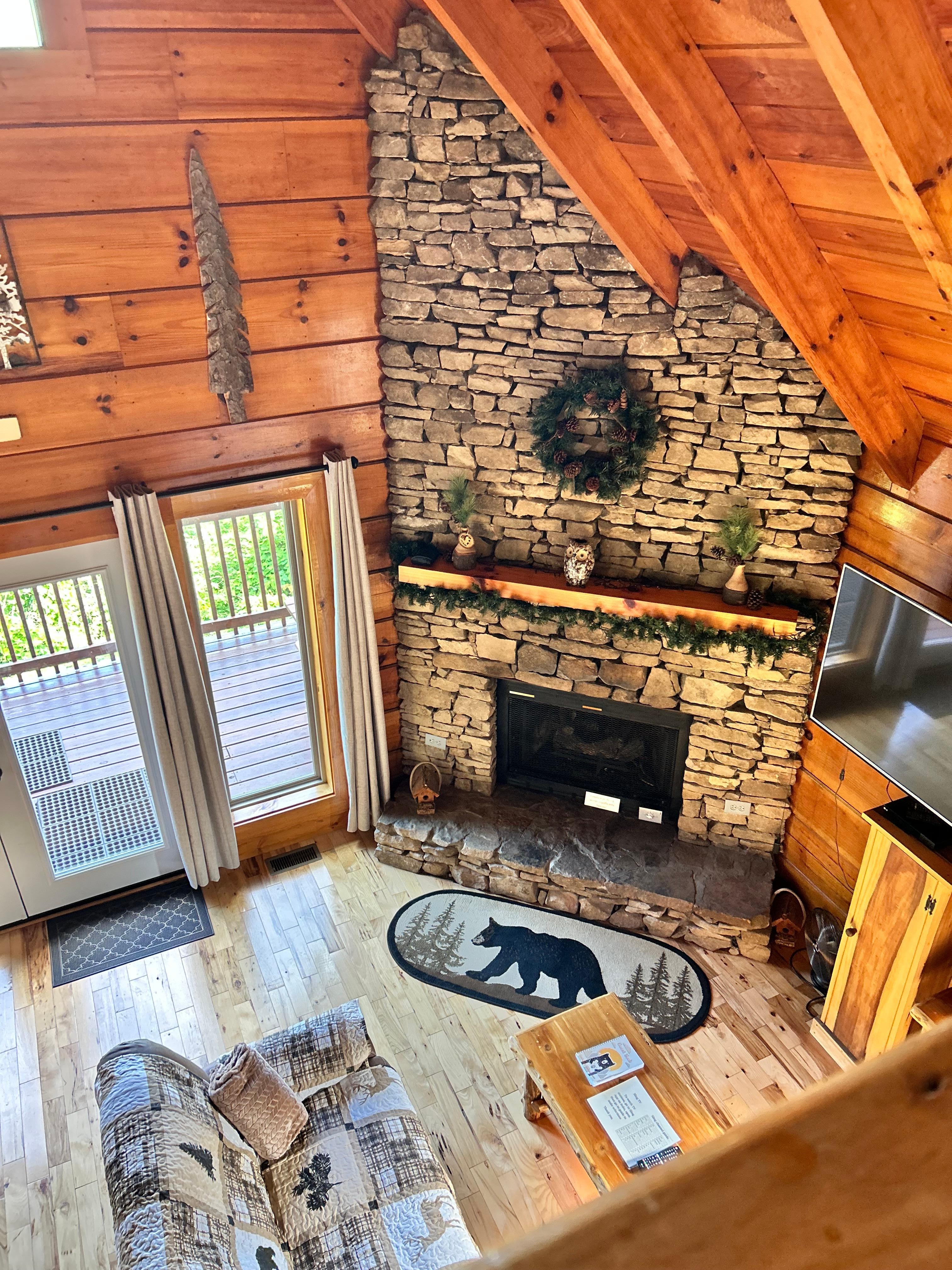 View of the living room from the bedroom up stairs. 