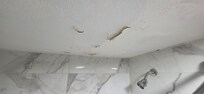 Water damage to bathroom ceiling