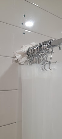 Paper towel holding shower rod
