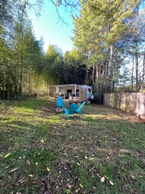 View from parking pad - neighbors on both sides but privacy fence helps.