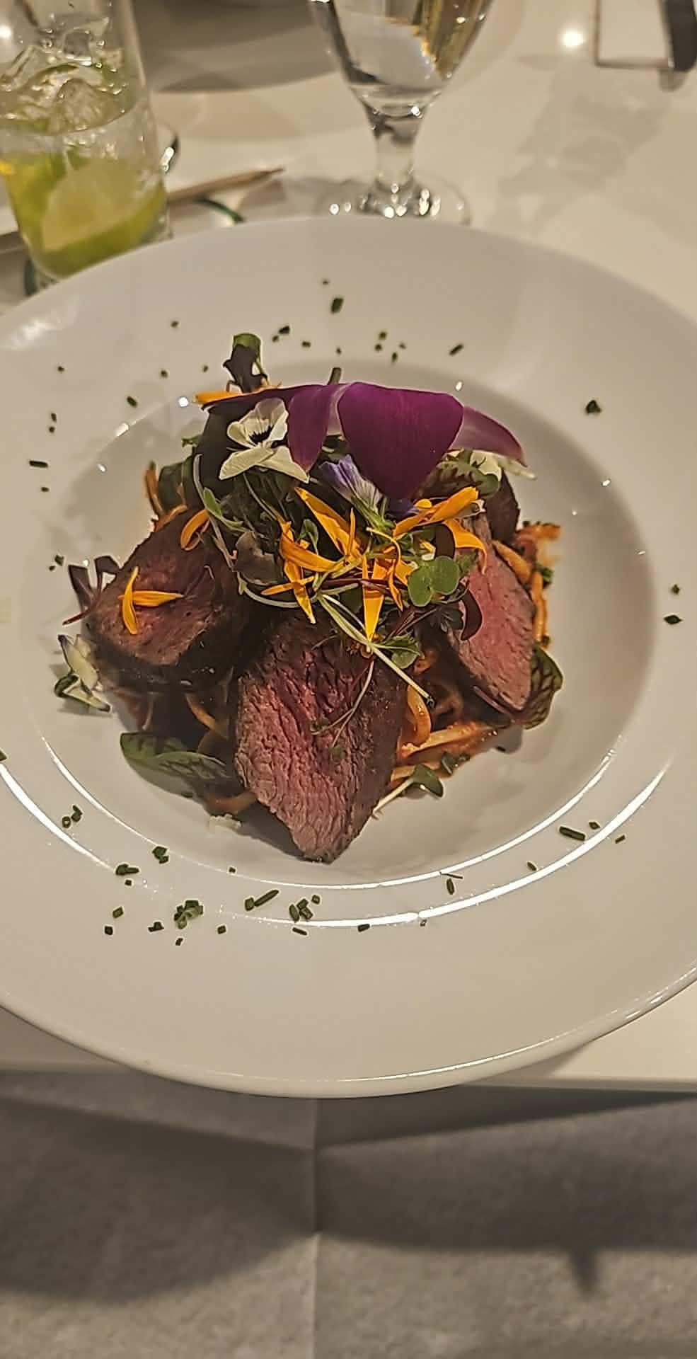 Linguine with garlic, onion, white wine and spicey red sauce, added beef noisettes $40. Excellent! 