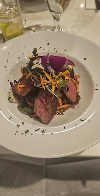 Linguine with garlic, onion, white wine and spicey red sauce, added beef noisettes $40. Excellent!