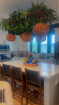 Beautiful kitchen with a gas stove and spacious island. Great for prepping/cooking a family meal.