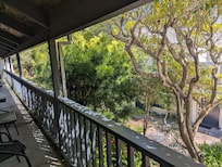 Shady balcony overlooking courtyard.