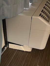 AC unit that was falling off the wall and dripping