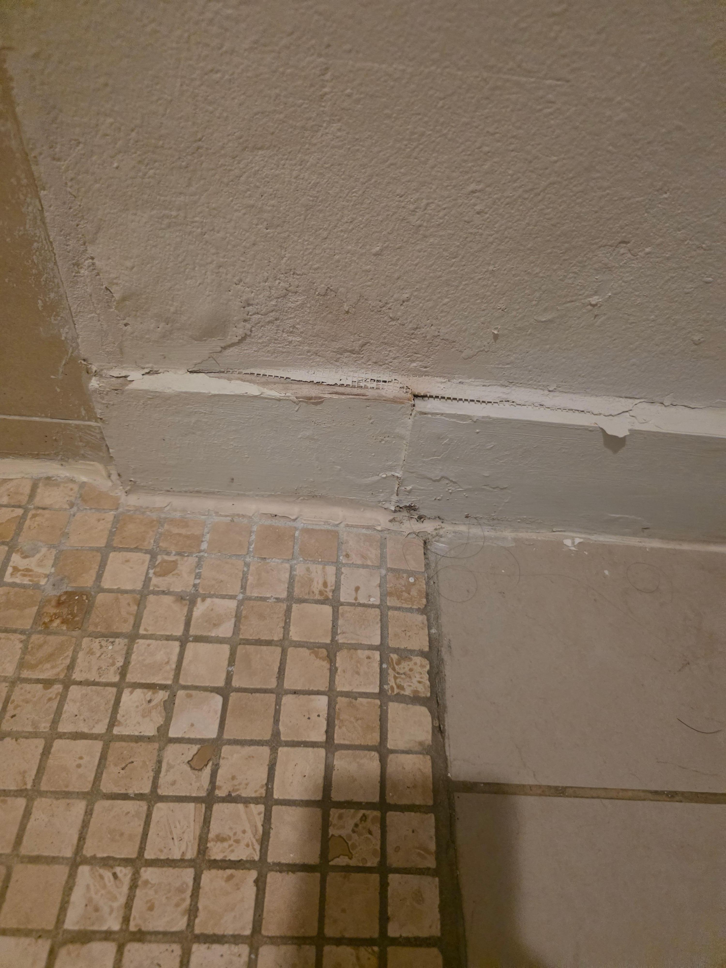 Bad caulking like this everywhere in the room and outside.