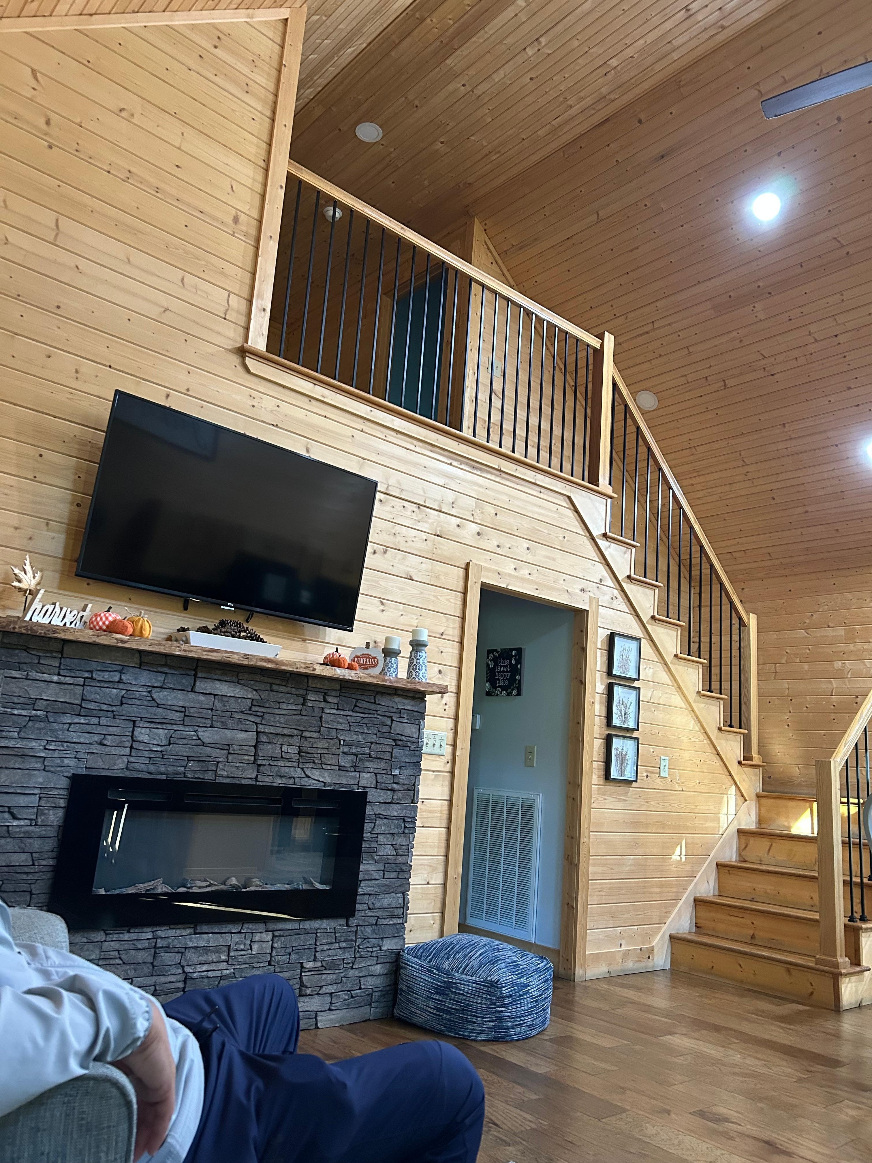 Sugar Bear Cabin view from living room to upstairs bedroom/bathroom and hall to the other three bedroom and bathroom. 