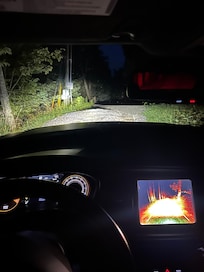 Photo of rut/pothole where gravel driveway meets the road