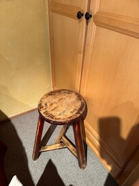 Stool holds closet door shut