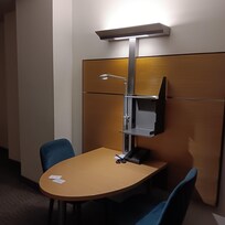 Desk with 2 comfortable velvety chairs and good lighting