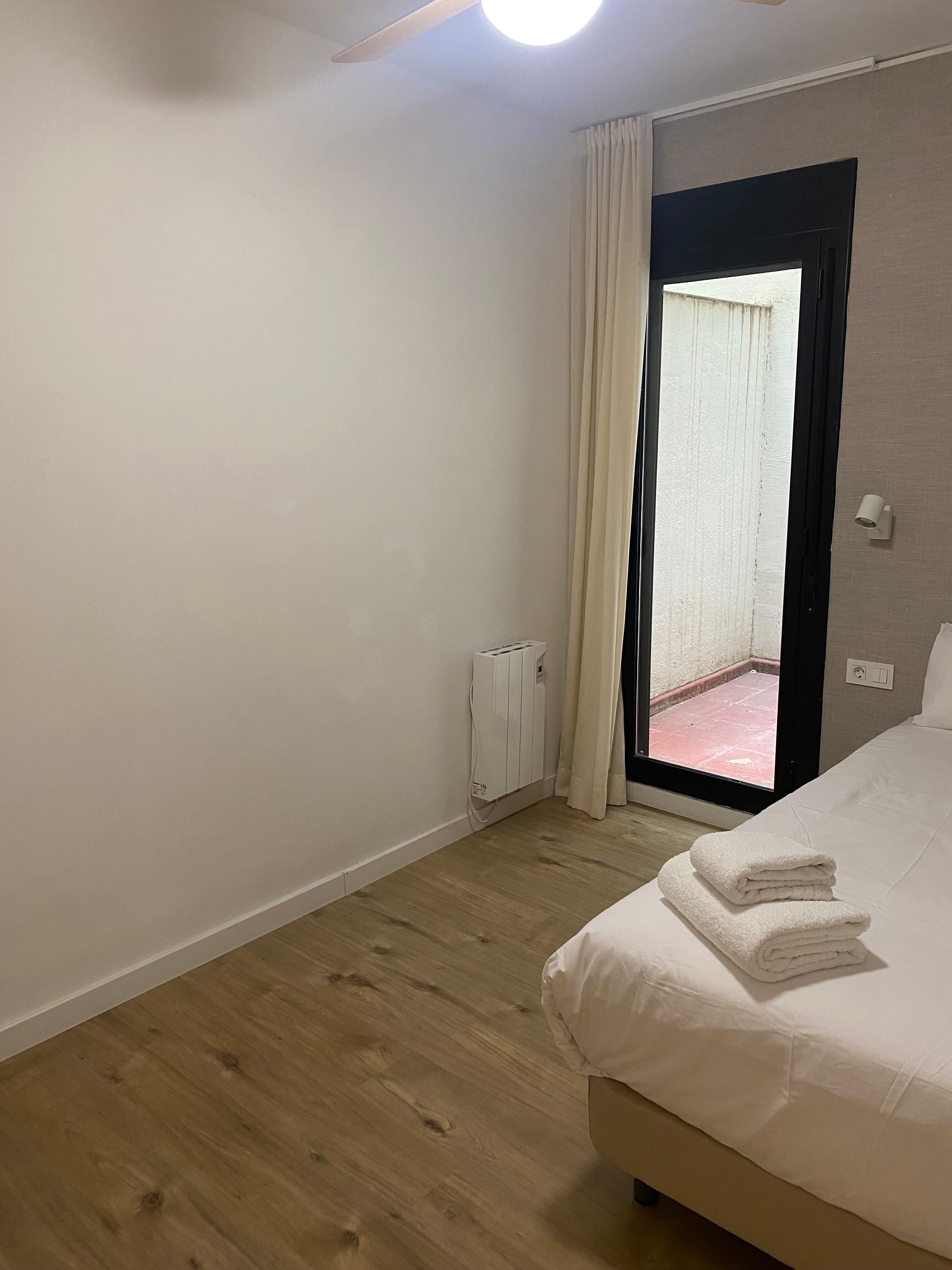 This is the view from another bedroom on the upper floor. It is still facing a tiny walled space.