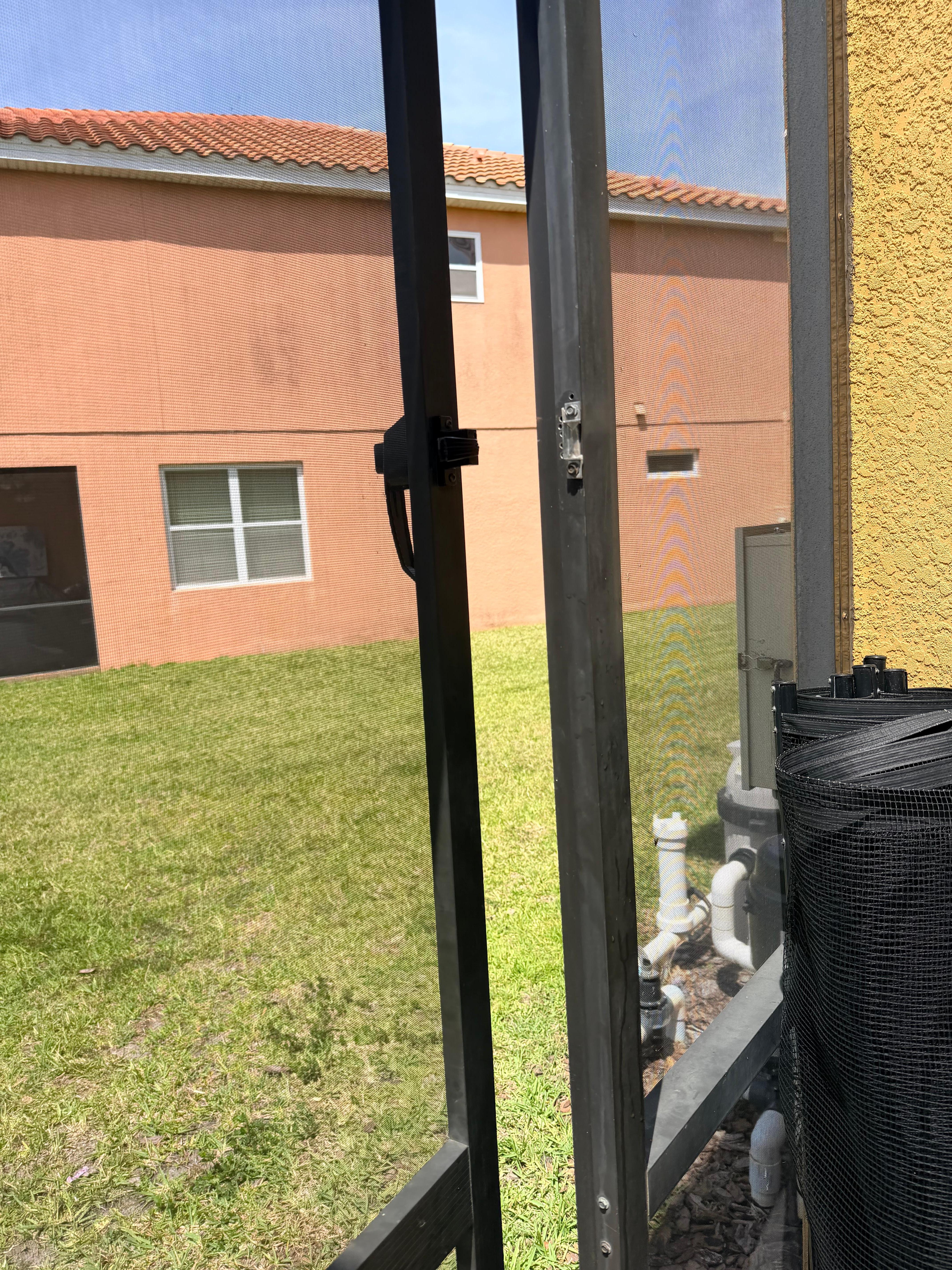 Broken door from the pool area to outside. 