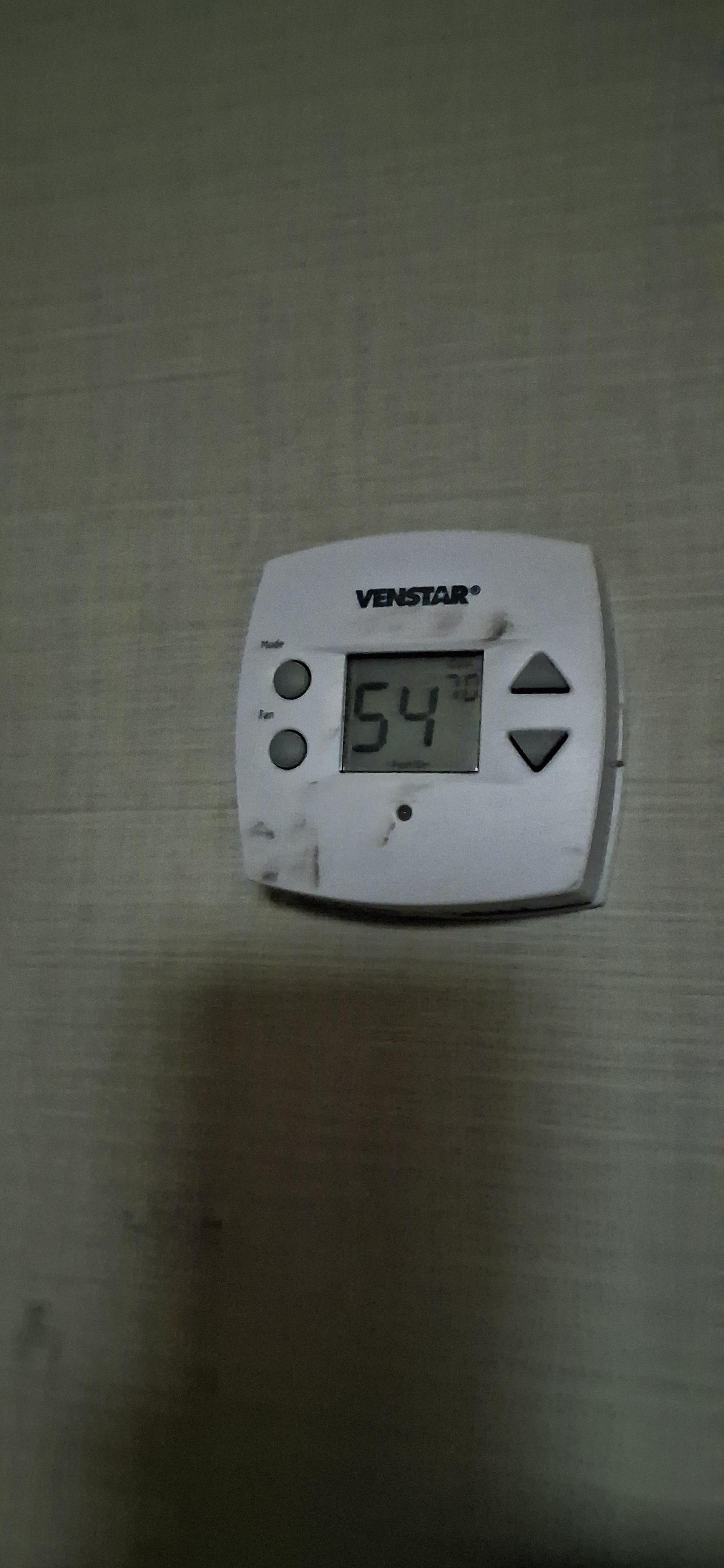 The heat monitor thermostat was broken and set on 54°. We couldn't change it. It looked like it had previously caught on fire or something. 