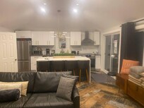 Incredible living room and kitchen, bathroom and bedroom. All state of the art stainless steal appliances. Fully equipped you could stay here comfortably with only the shirt on your back, hamberger buns and ground beef. That's all you'd need 4 a week