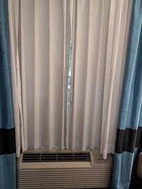 Curtain didn't fully close. Street light shined right into the bed.