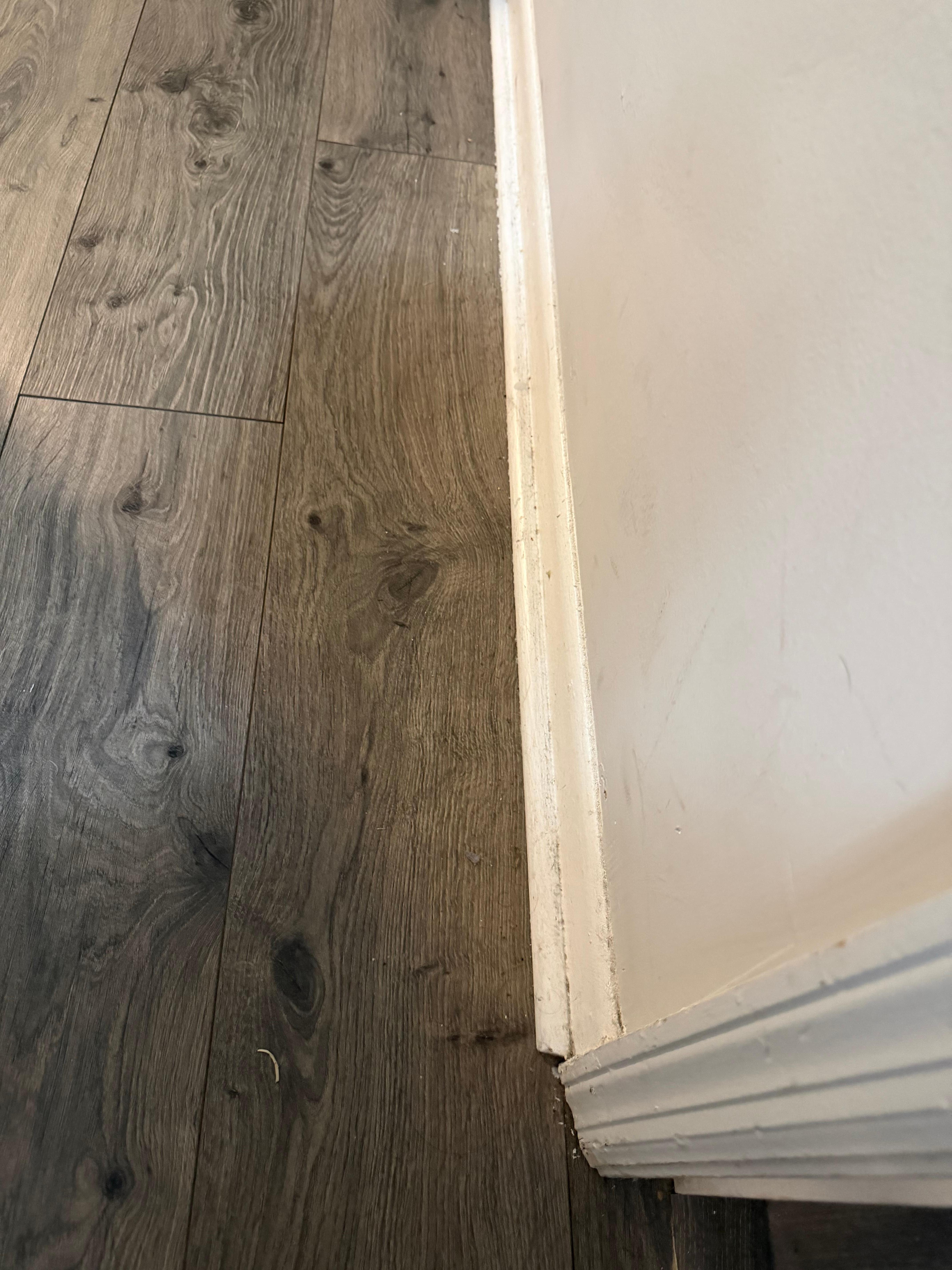 Scarred walls and dirty baseboard