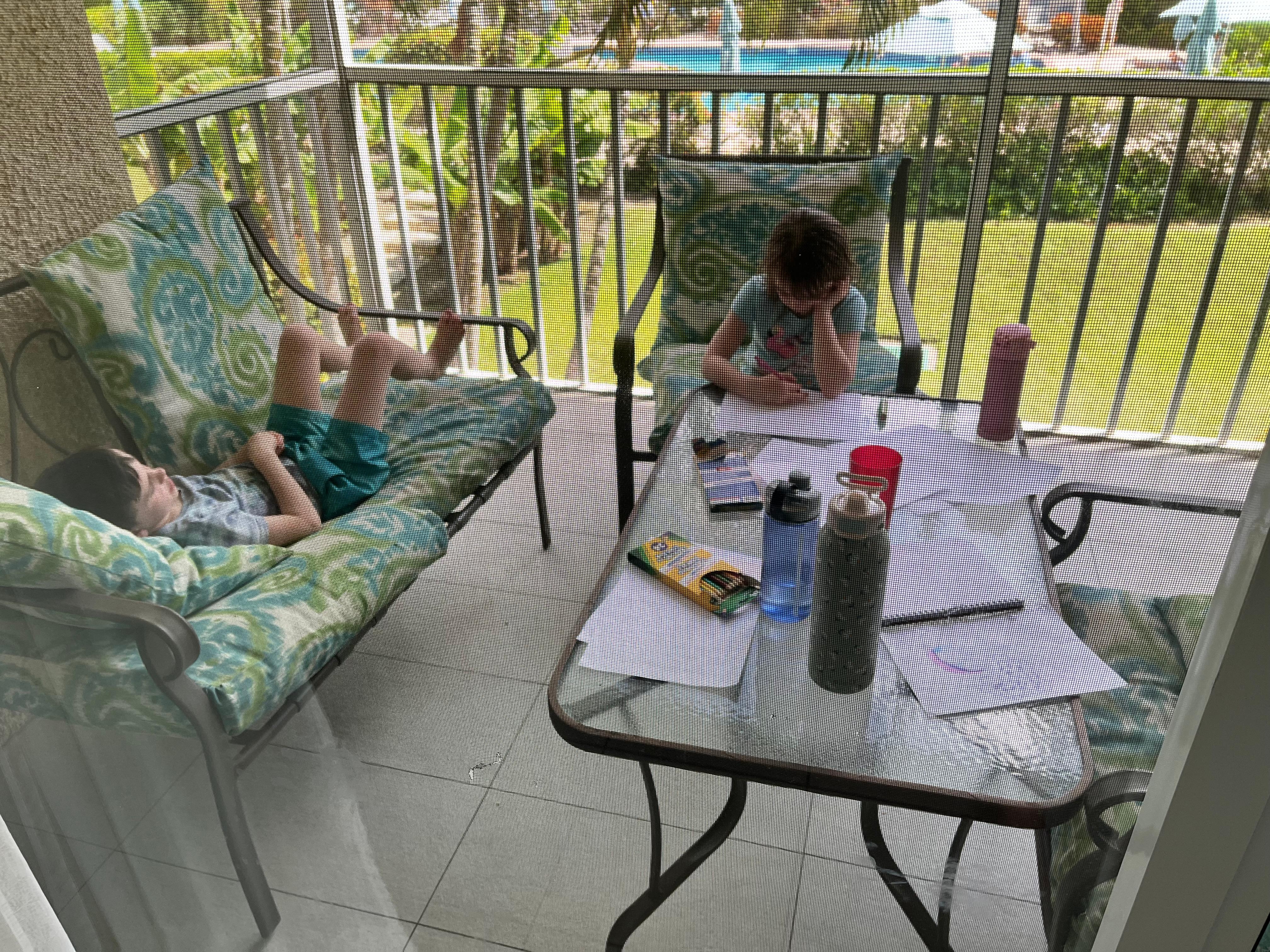 Homework on the balcony overlooking the pool
