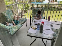 Homework on the balcony overlooking the pool
