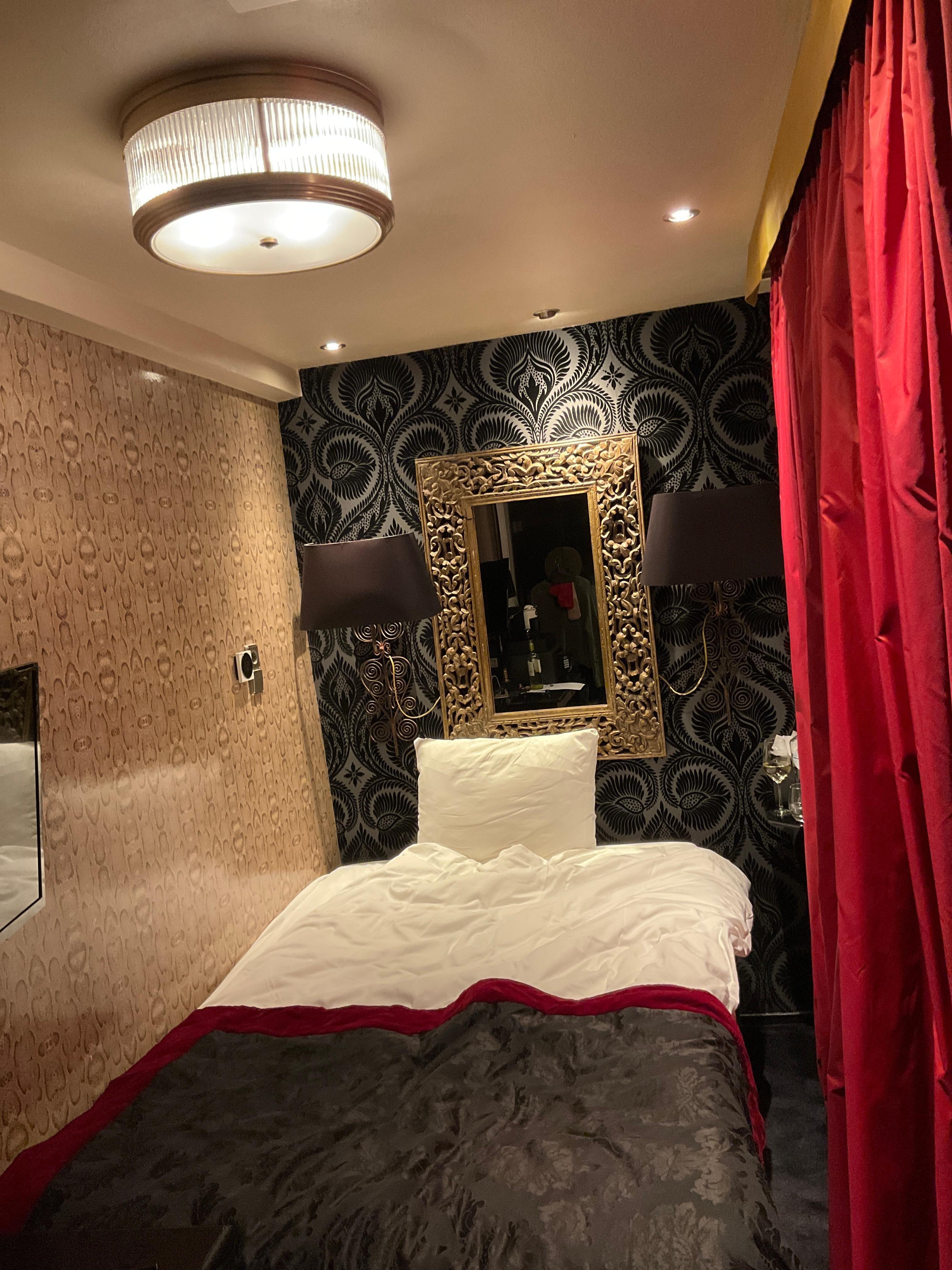 The room. There is a bath by the door. 