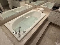 Spa bath and walk in shower.