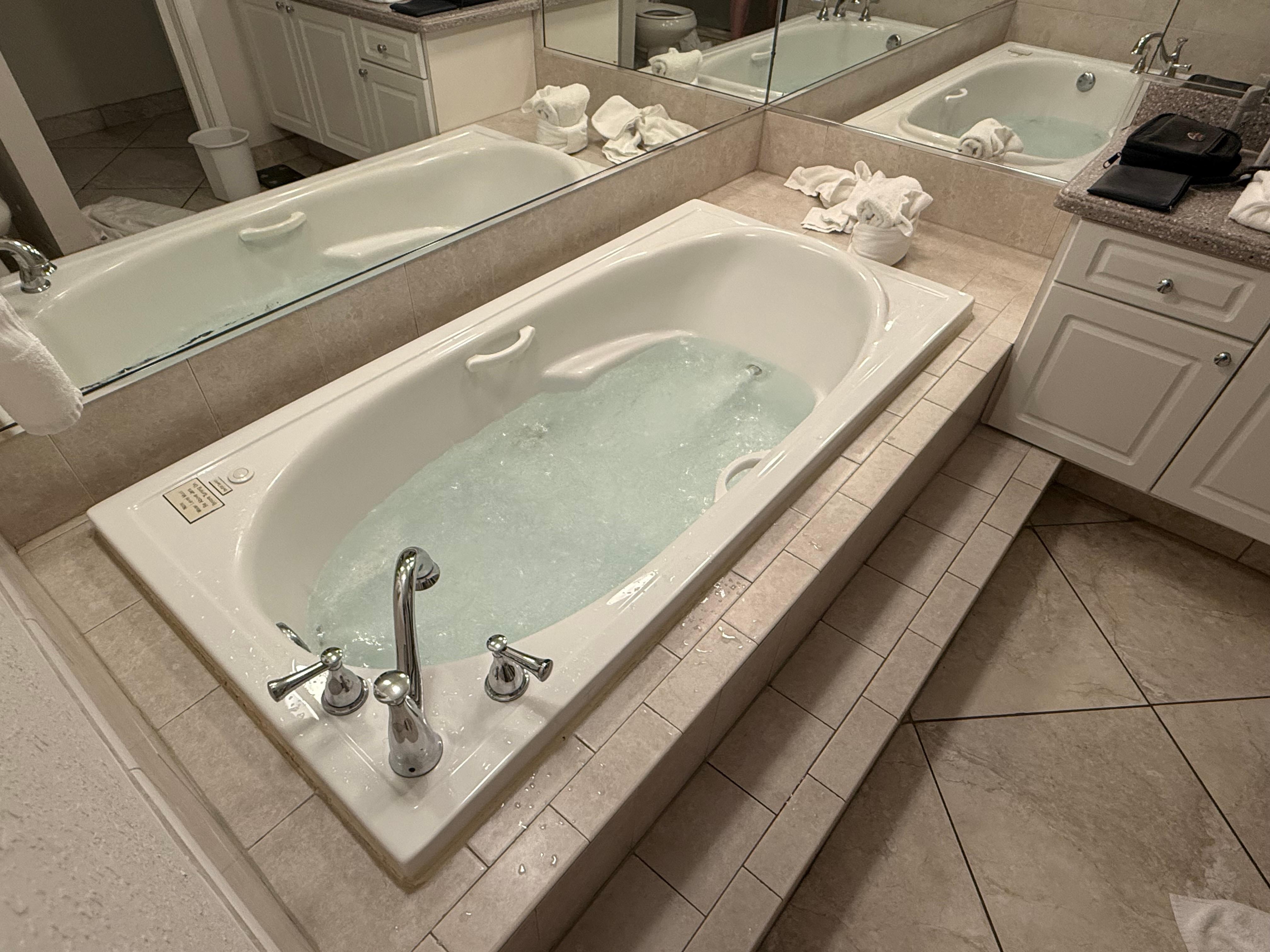 Spa bath and walk in shower.