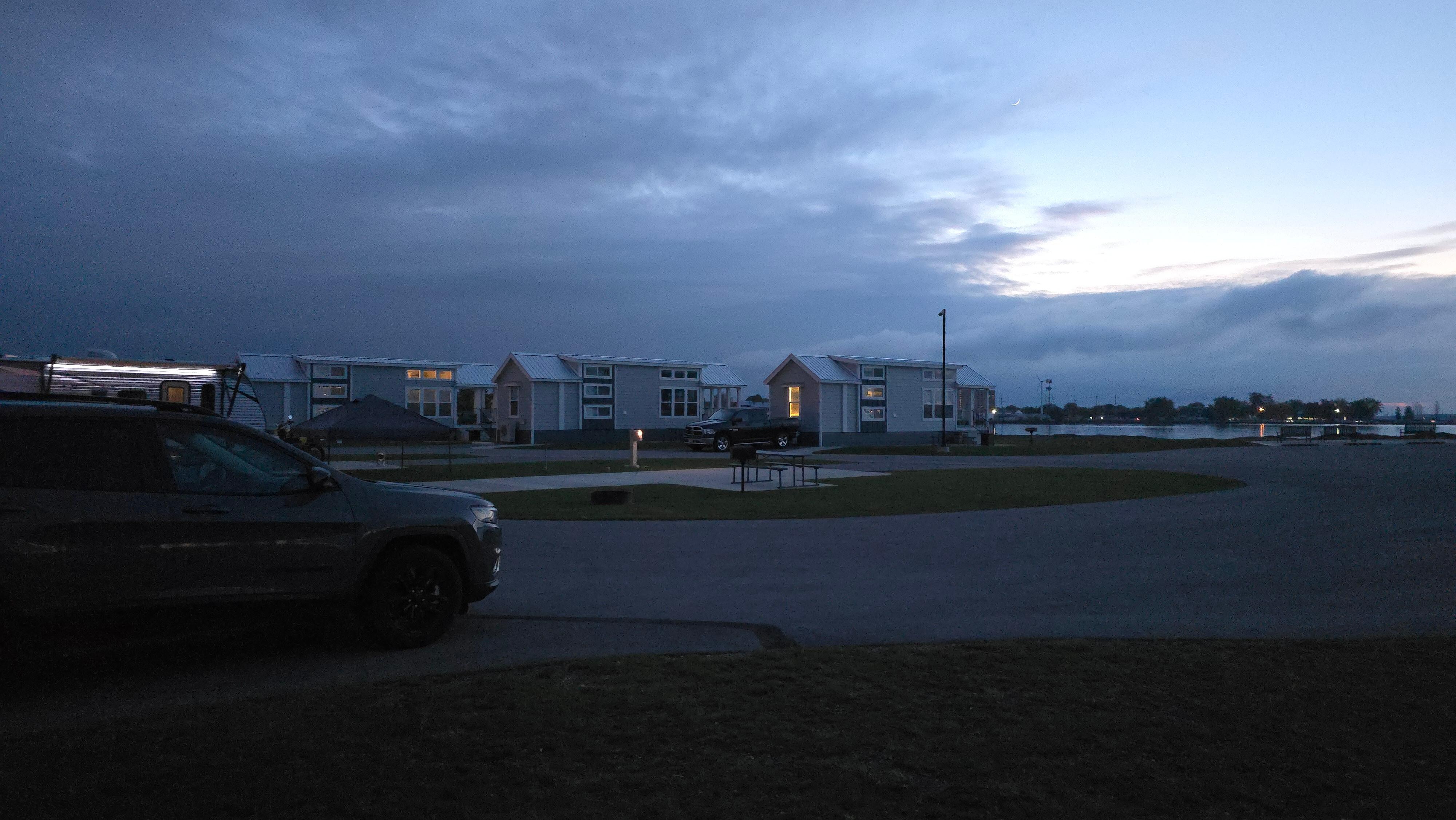 Comfy cottage is located in what feels like a campsite. There are other cottages and space for RVs.
