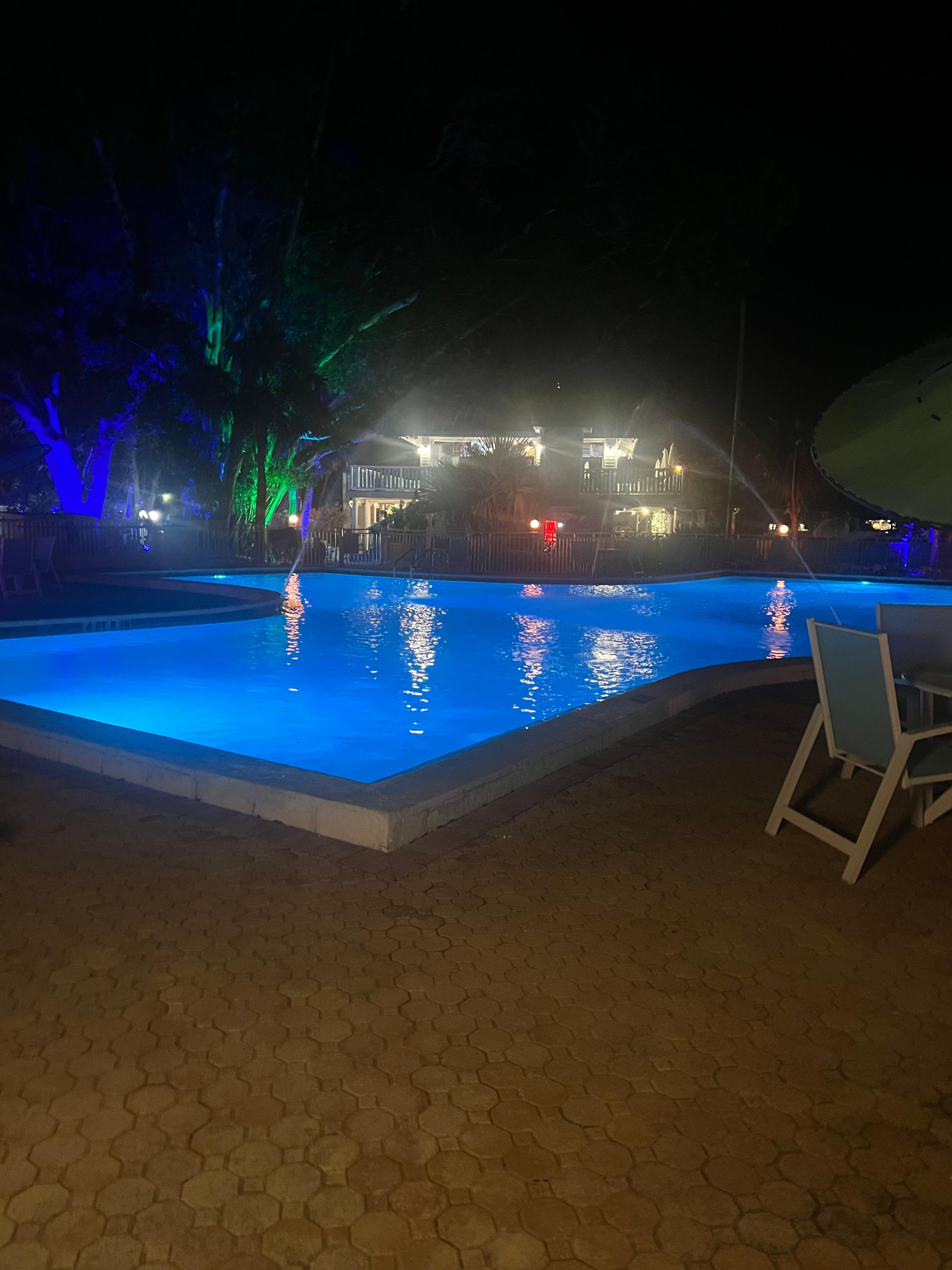  Nighttime view of the pool and the area lit up.